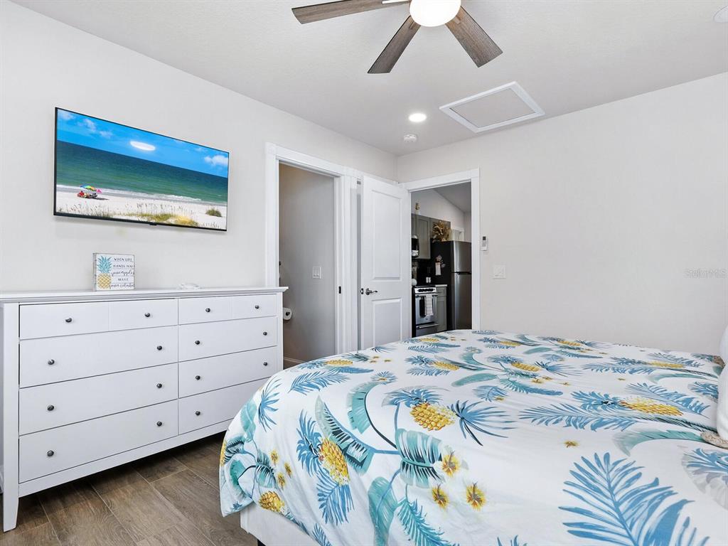 544 Canal Road Sarasota, FL 34242 - Photo 19 of 35 a bedroom with a bed and a dresser