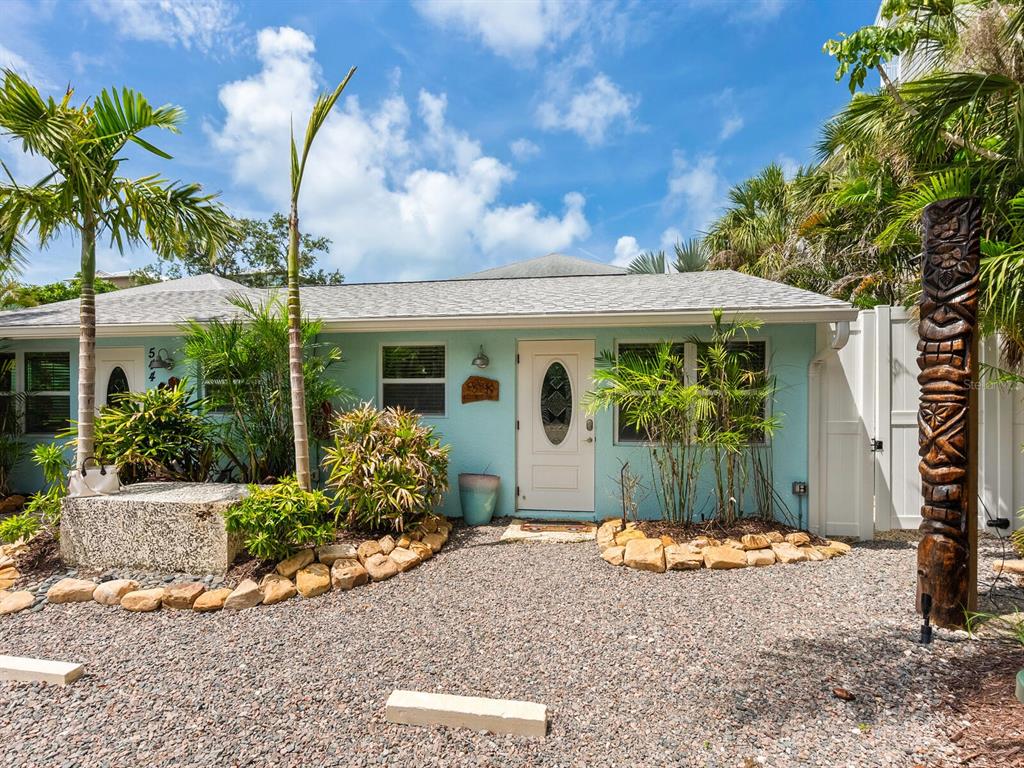 544 Canal Road Sarasota, FL 34242 - Photo 2 of 35 a front view of a house with garden