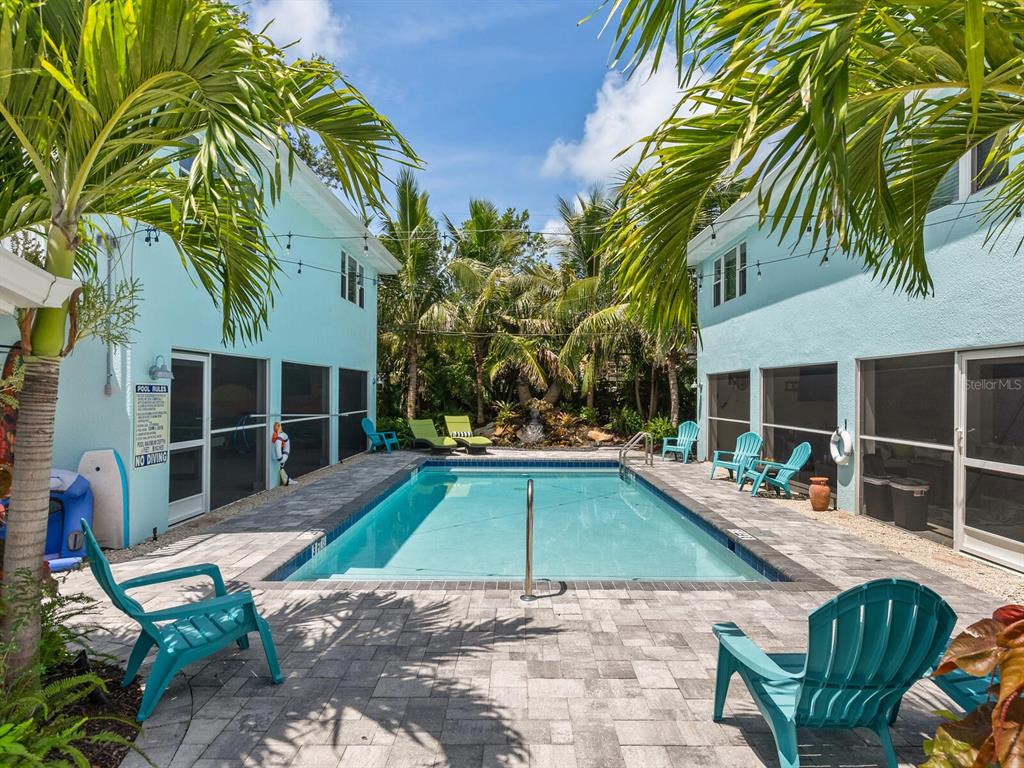 544 Canal Road Sarasota, FL 34242 - Photo 22 of 35 a view of a house with swimming pool and sitting area