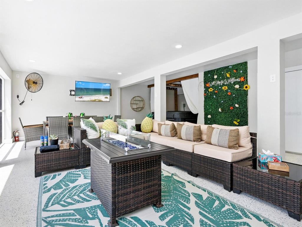 544 Canal Road Sarasota, FL 34242 - Photo 24 of 35 a living room with furniture and a large window