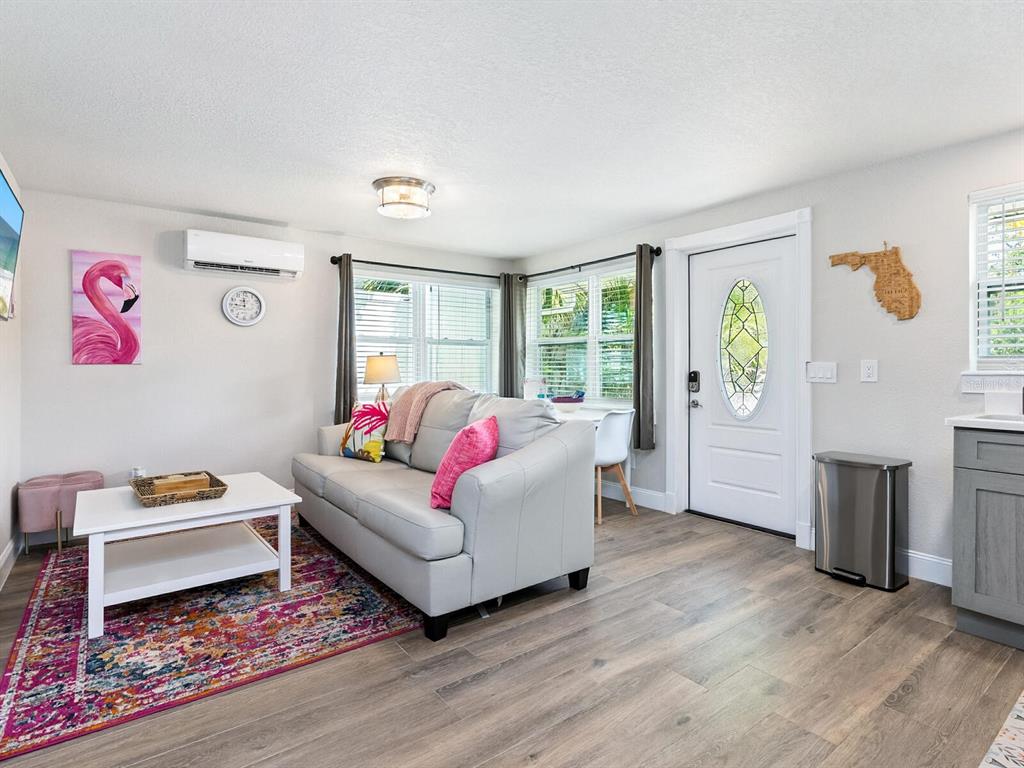 544 Canal Road Sarasota, FL 34242 - Photo 4 of 35 a living room with furniture and a wooden floor