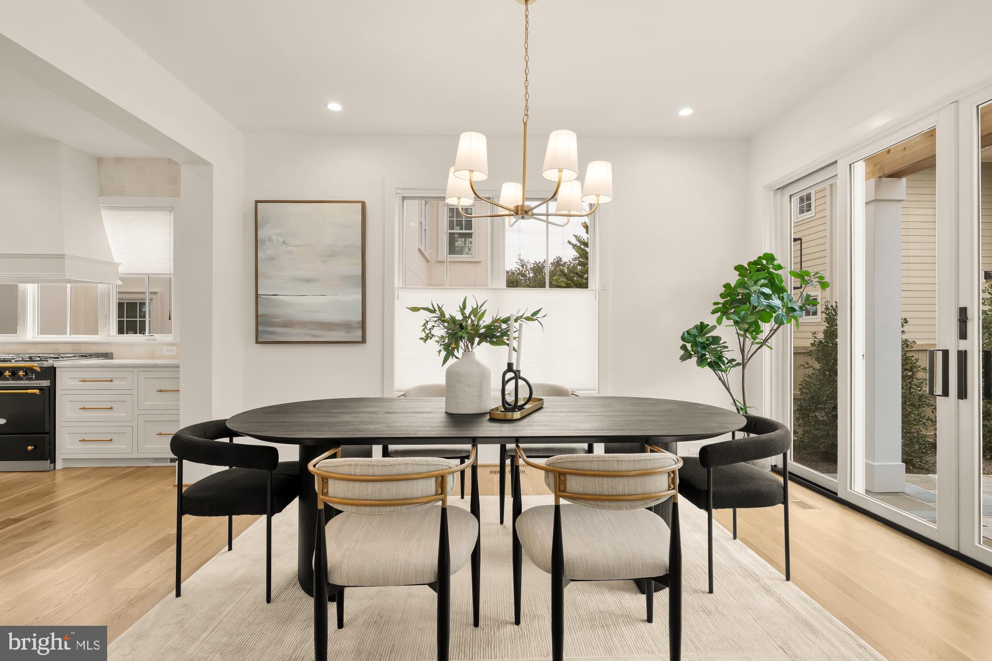 4427 Ridge Street Chevy Chase, MD 20815 - Photo 12 of 42 a view of a dining room with furniture and wooden floor