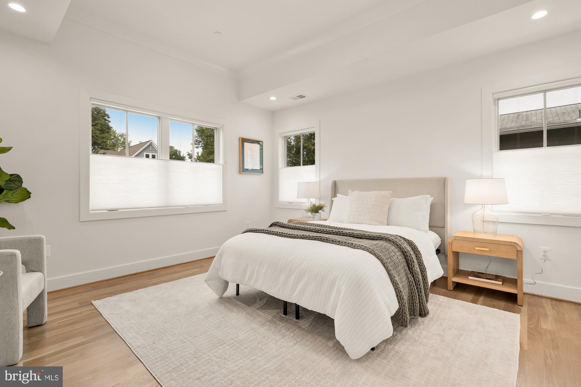 4427 Ridge Street Chevy Chase, MD 20815 - Photo 15 of 42 a bedroom with a bed and a window