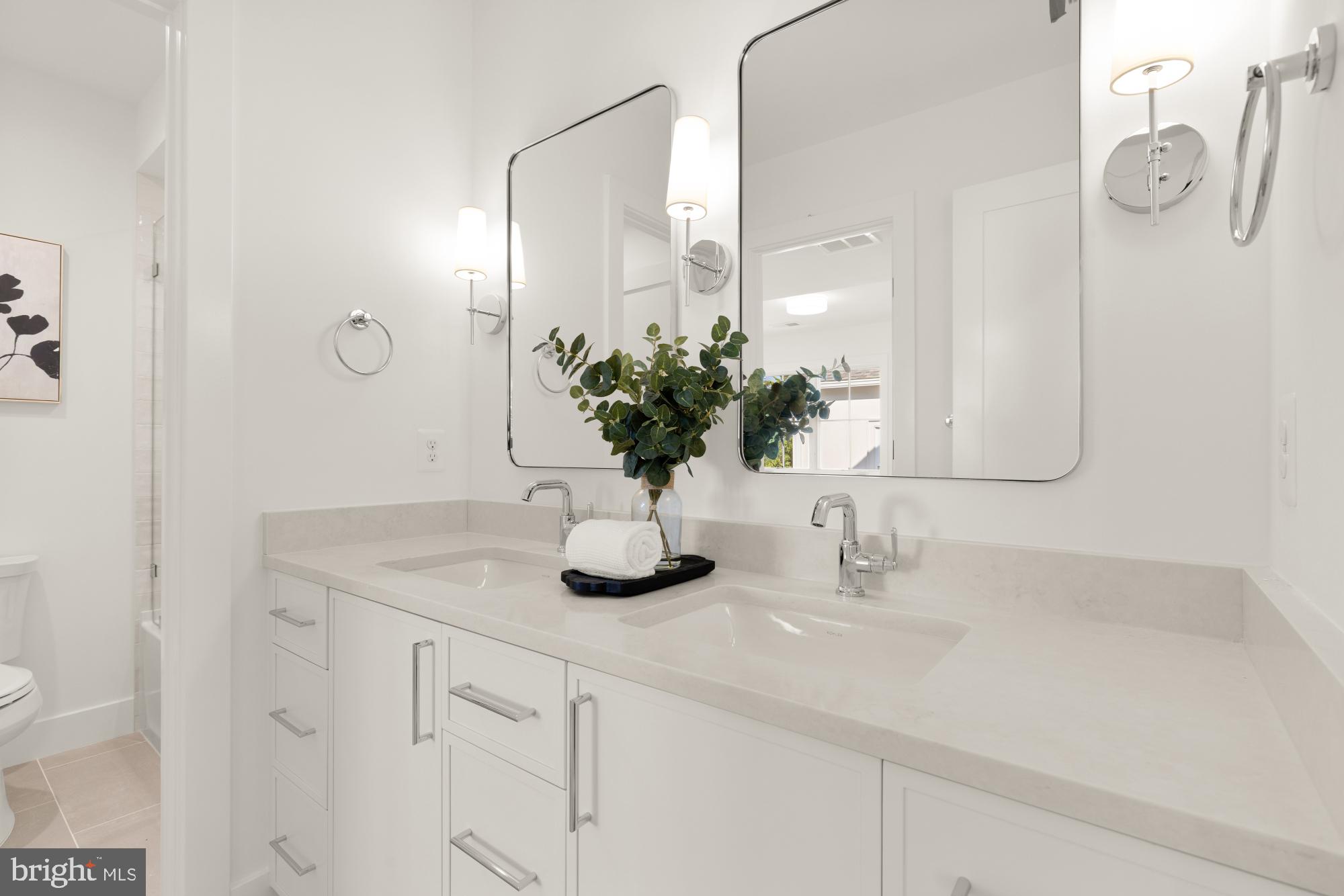 4427 Ridge Street Chevy Chase, MD 20815 - Photo 21 of 42 a bathroom with a sink a vanity and a mirror