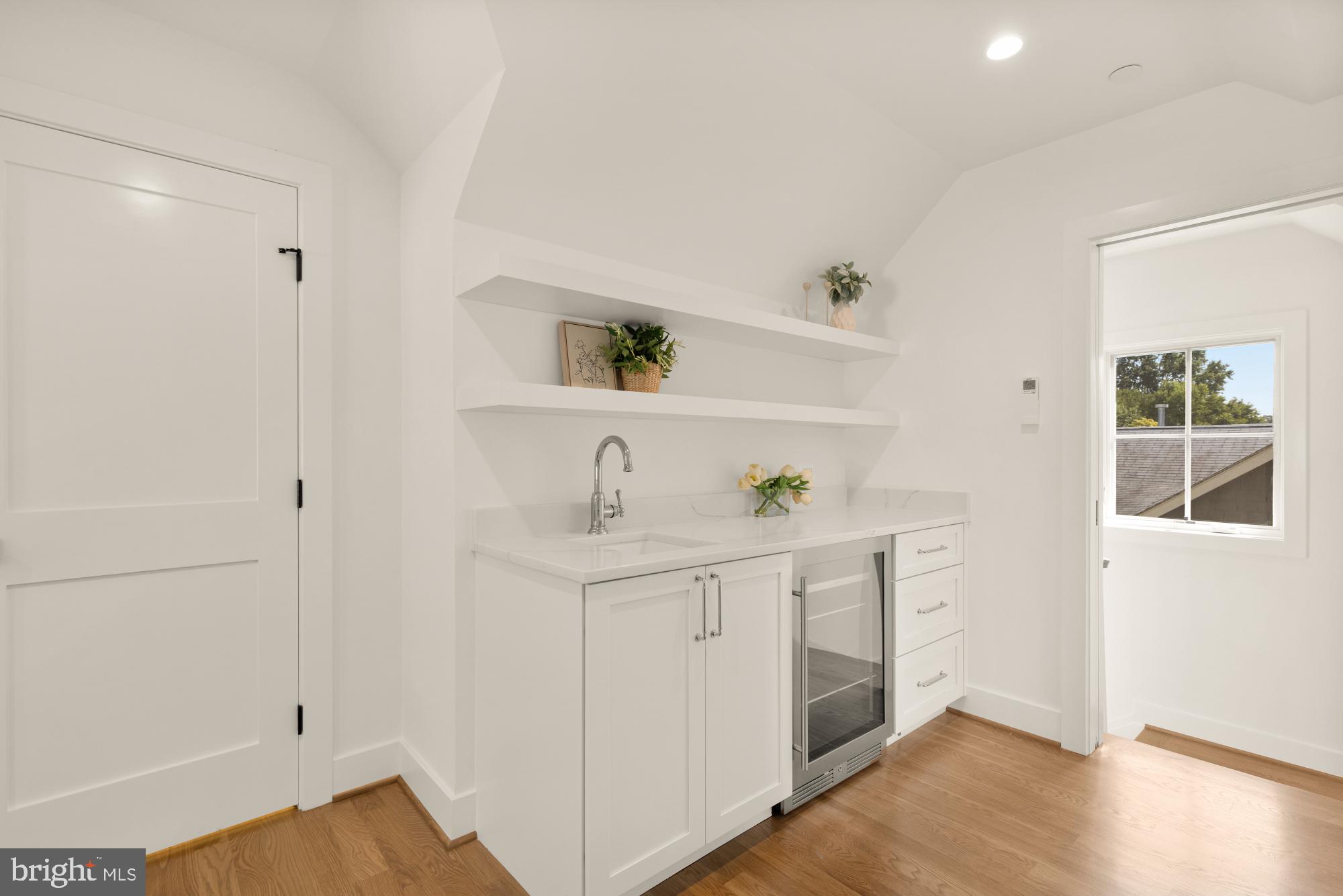 4427 Ridge Street Chevy Chase, MD 20815 - Photo 24 of 42 a kitchen with a sink and cabinets