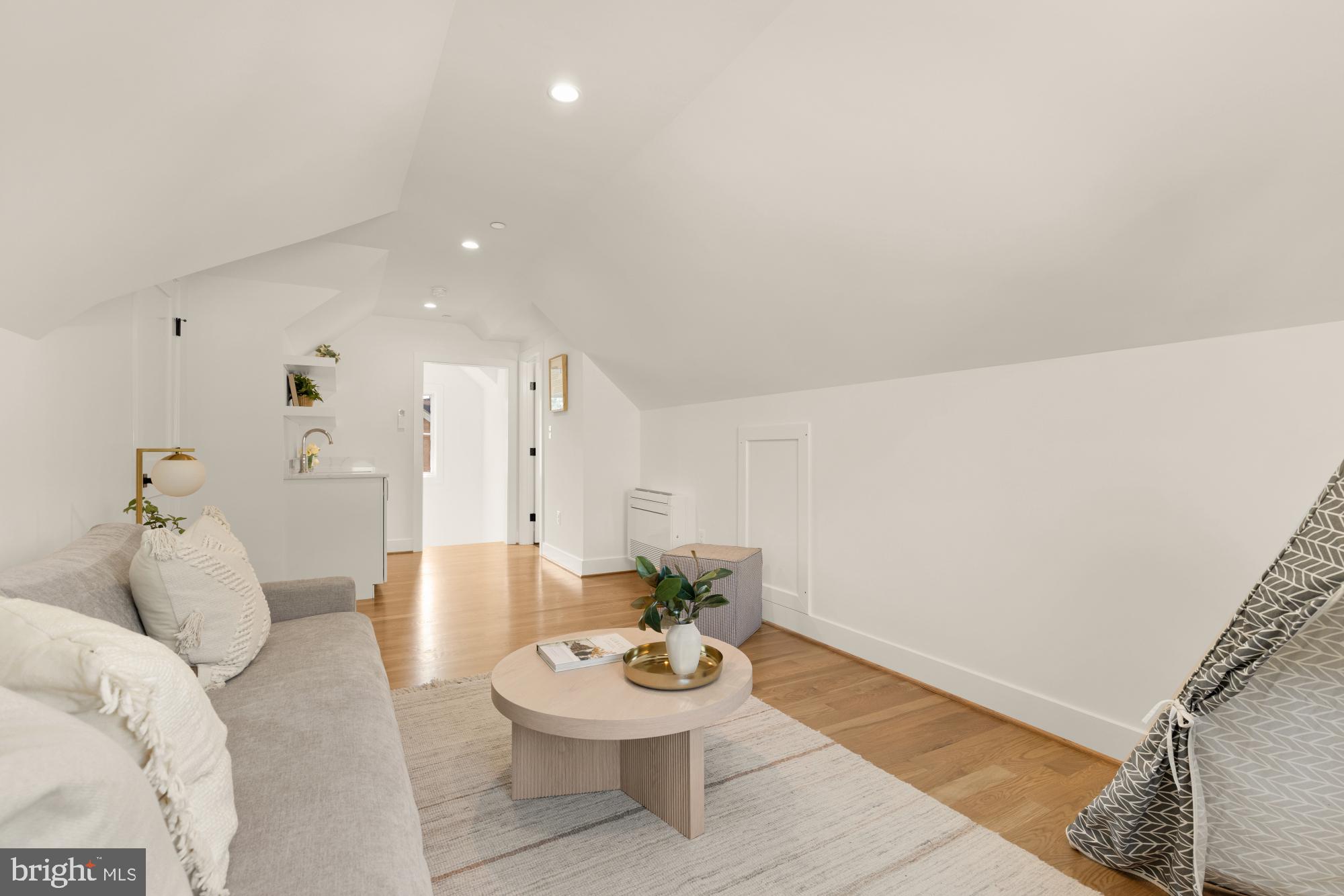 4427 Ridge Street Chevy Chase, MD 20815 - Photo 26 of 42 a living room with furniture and a wooden floor