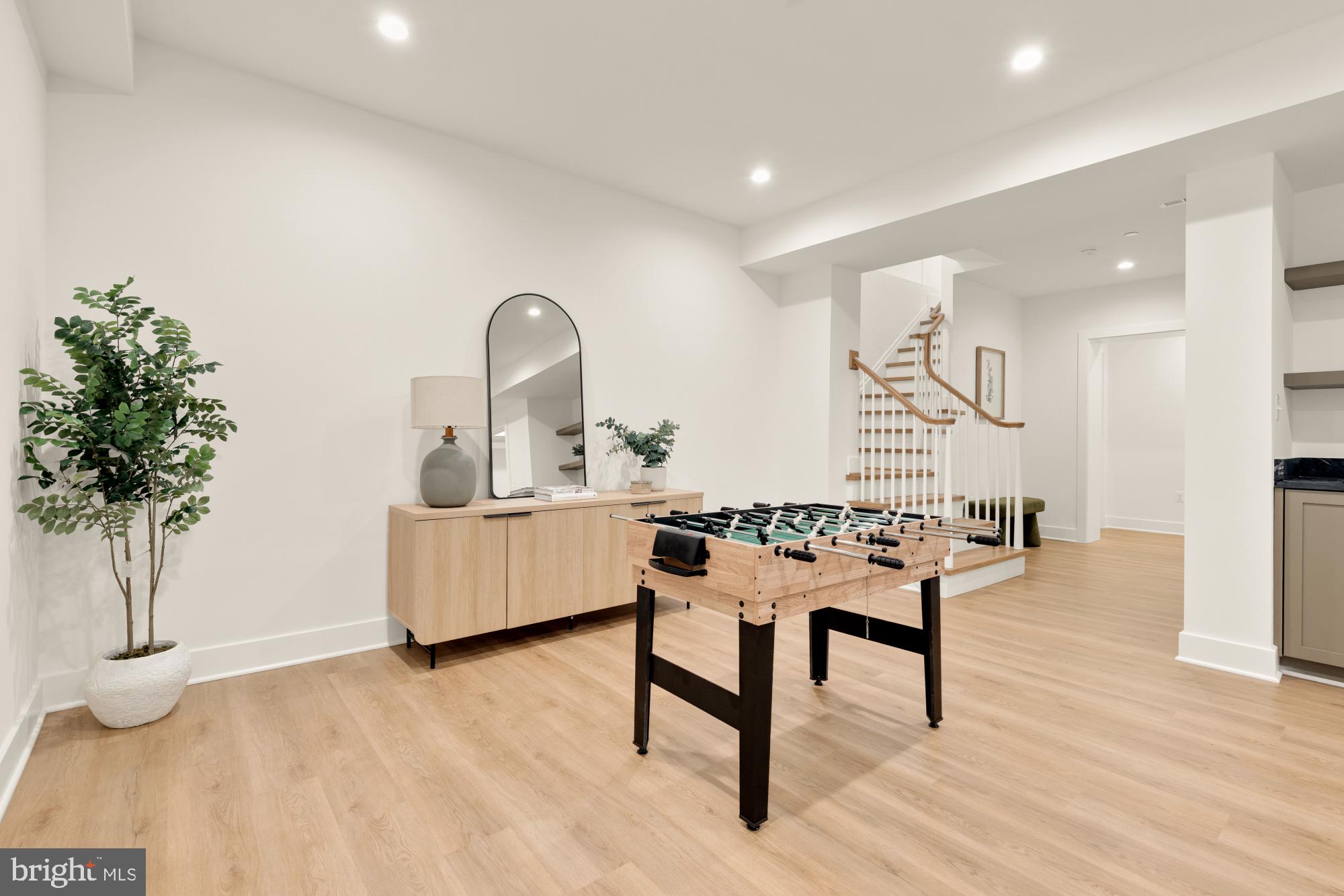 4427 Ridge Street Chevy Chase, MD 20815 - Photo 31 of 42 a living room with furniture and a potted plant