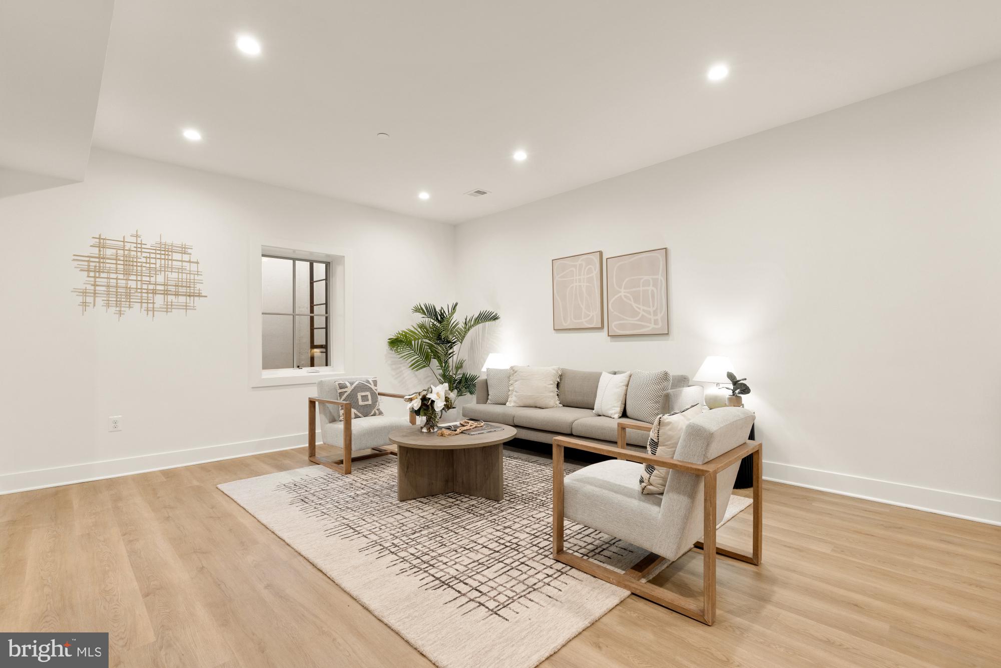 4427 Ridge Street Chevy Chase, MD 20815 - Photo 32 of 42 a living room with furniture and wooden floor