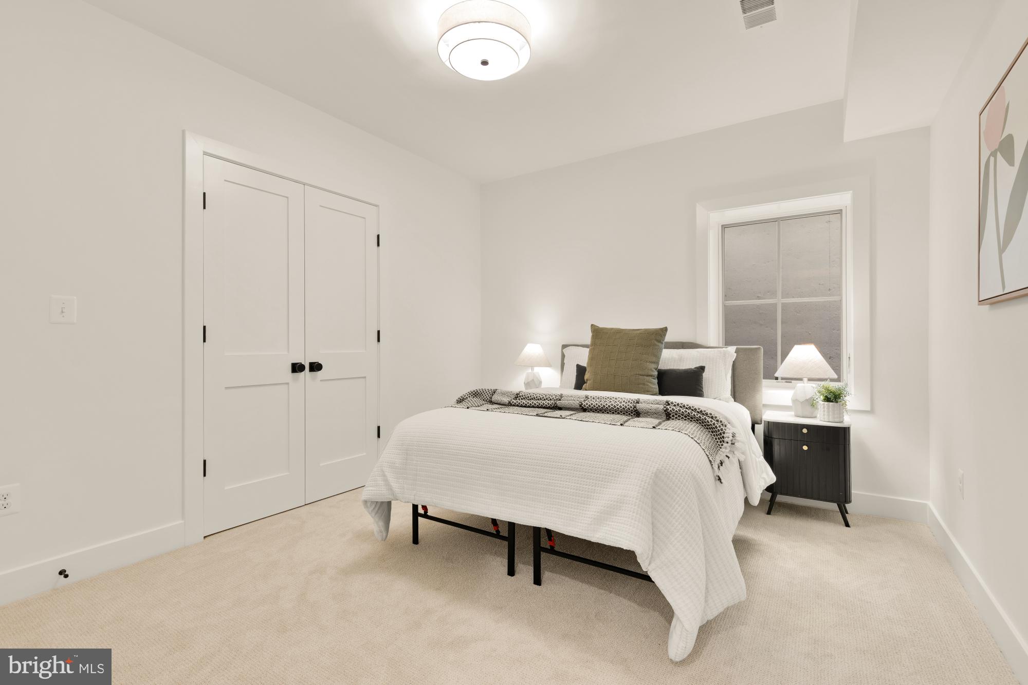 4427 Ridge Street Chevy Chase, MD 20815 - Photo 38 of 42 a bed room with a bed and a table