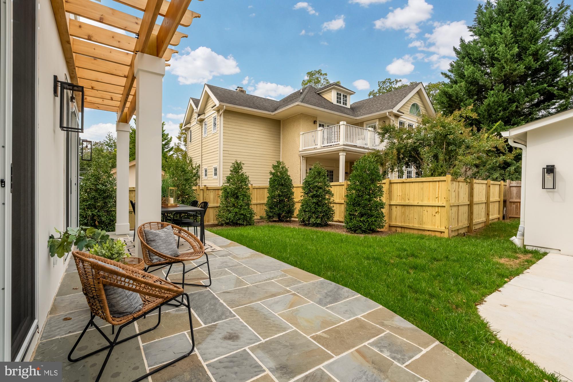 4427 Ridge Street Chevy Chase, MD 20815 - Photo 40 of 42 a view of a house with backyard and a garden