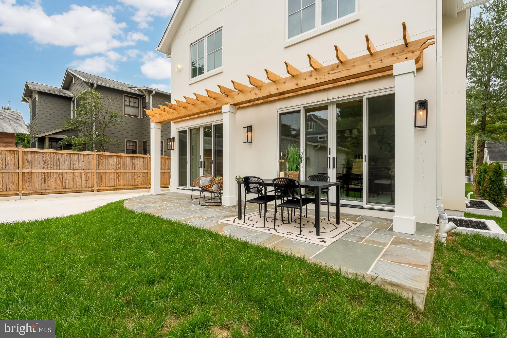 4427 Ridge Street Chevy Chase, MD 20815 - Photo 41 of 42 a view of a house with a backyard and a patio