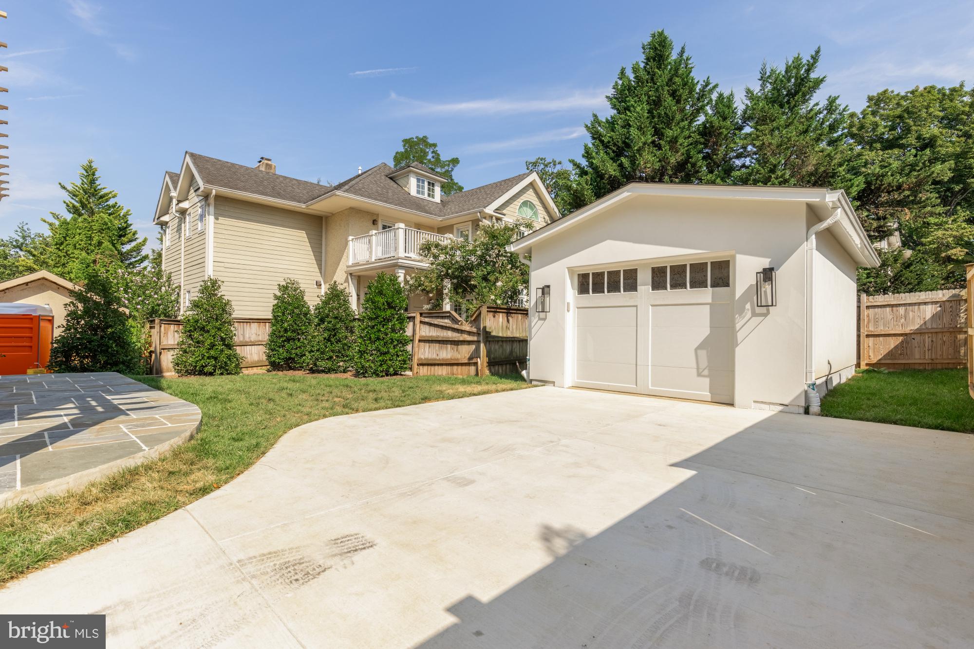 4427 Ridge Street Chevy Chase, MD 20815 - Photo 42 of 42 a front view of a house with a yard and garage