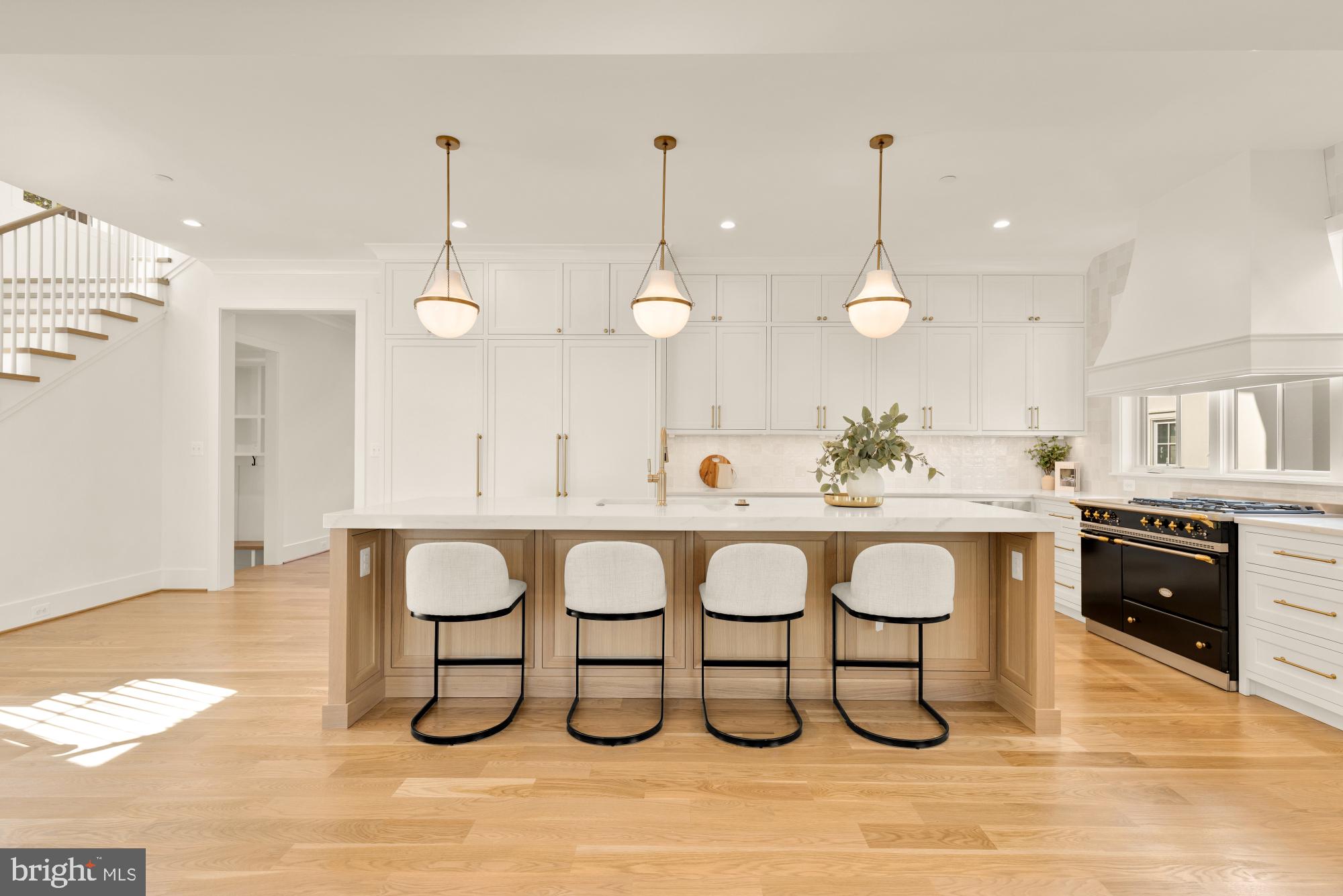 4427 Ridge Street Chevy Chase, MD 20815 - Photo 6 of 42 a large kitchen with a table and chairs