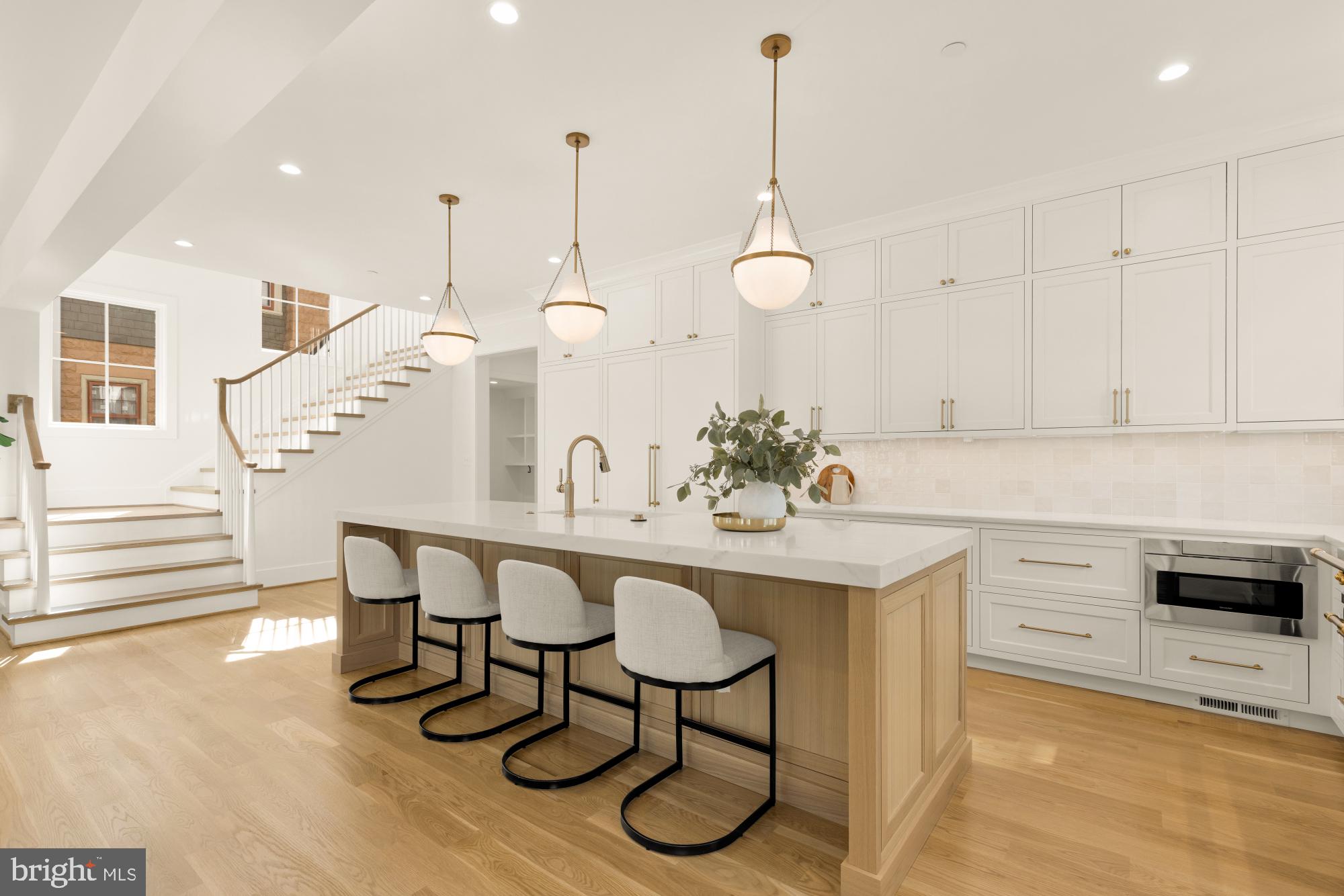 4427 Ridge Street Chevy Chase, MD 20815 - Photo 7 of 42 a kitchen with a sink cabinets and wooden floor