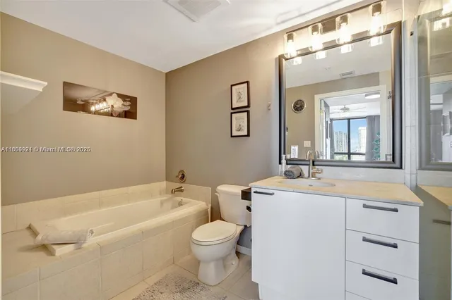 a bathroom with a toilet a sink and a bathtub