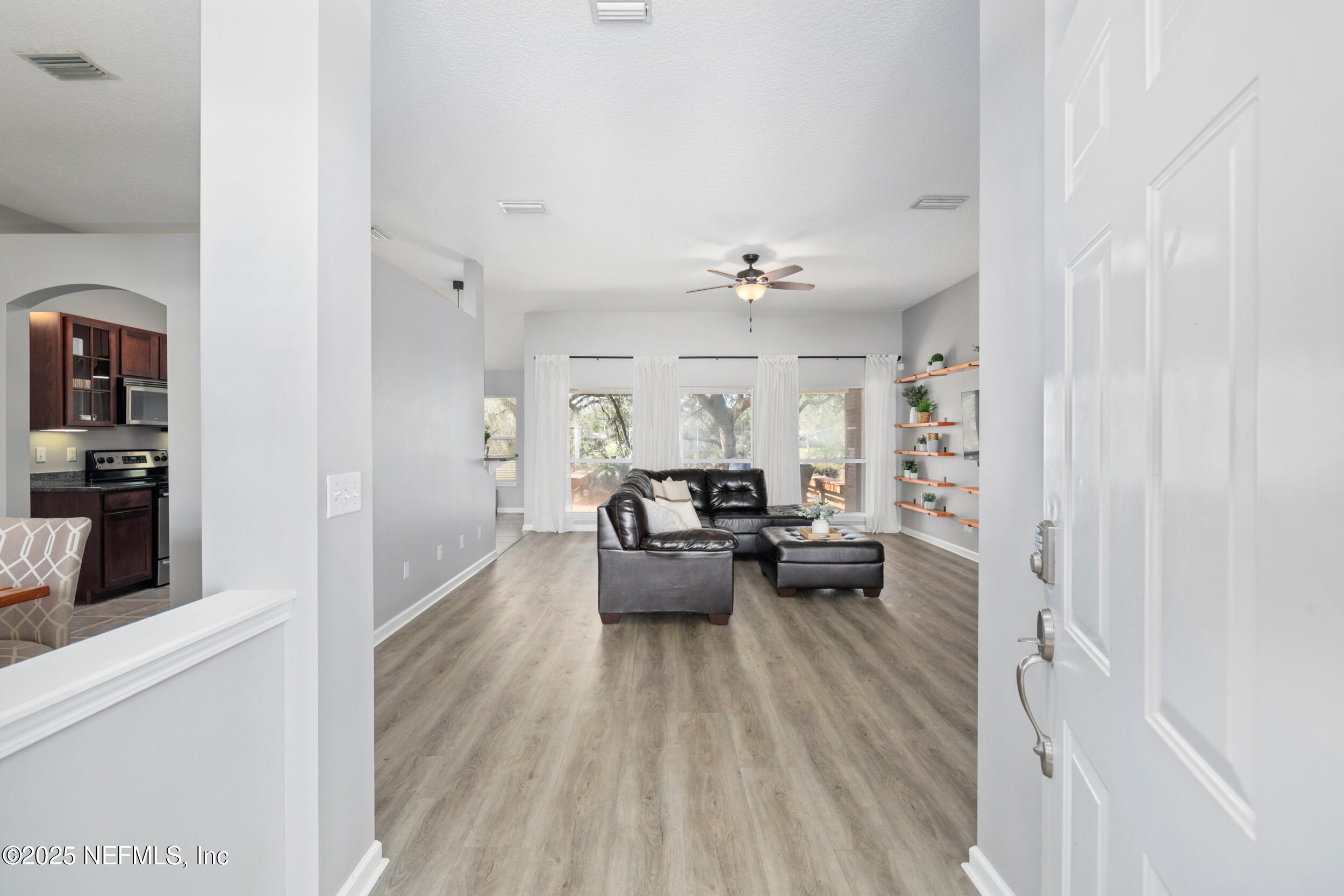 2948 Captiva Bluff Road South Jacksonville, FL 32226 - Photo 13 of 46 a view of a living room and dining room