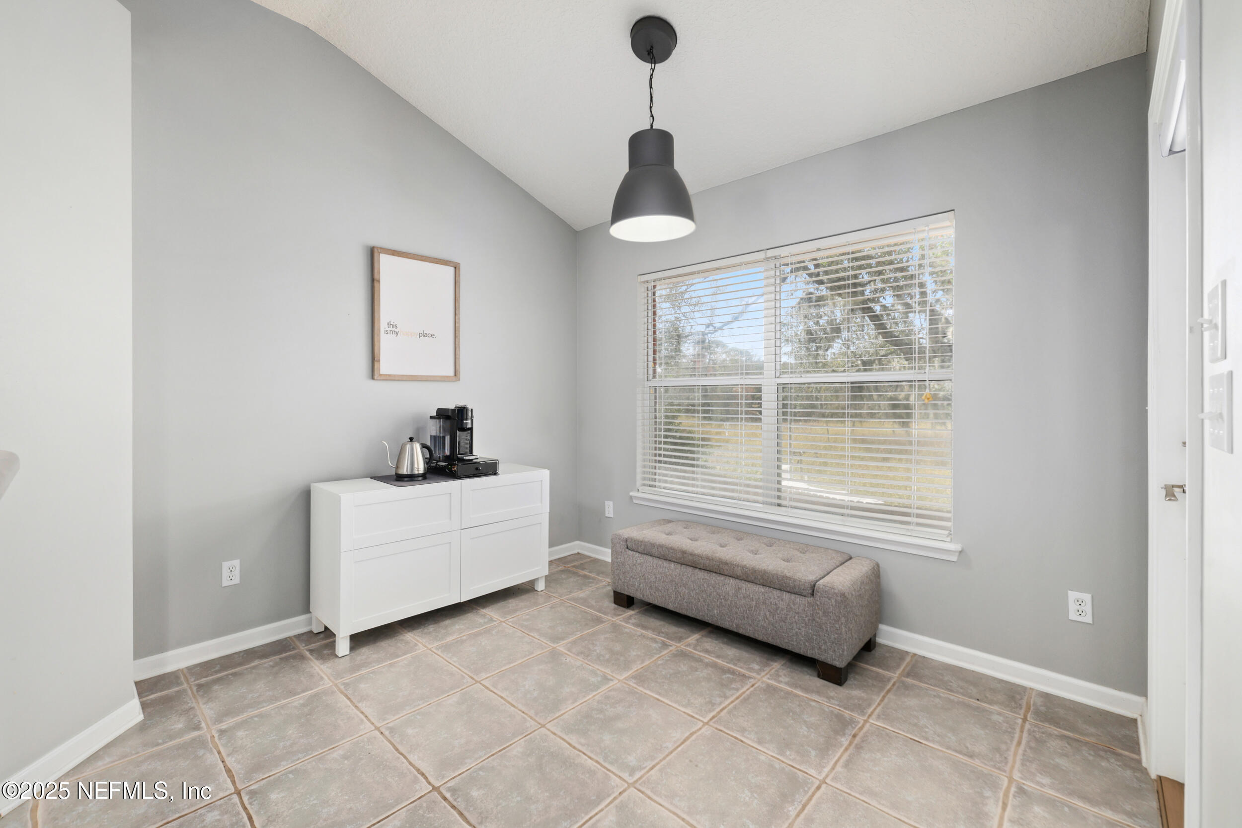 2948 Captiva Bluff Road South Jacksonville, FL 32226 - Photo 17 of 46 a room with windows and a chandelier