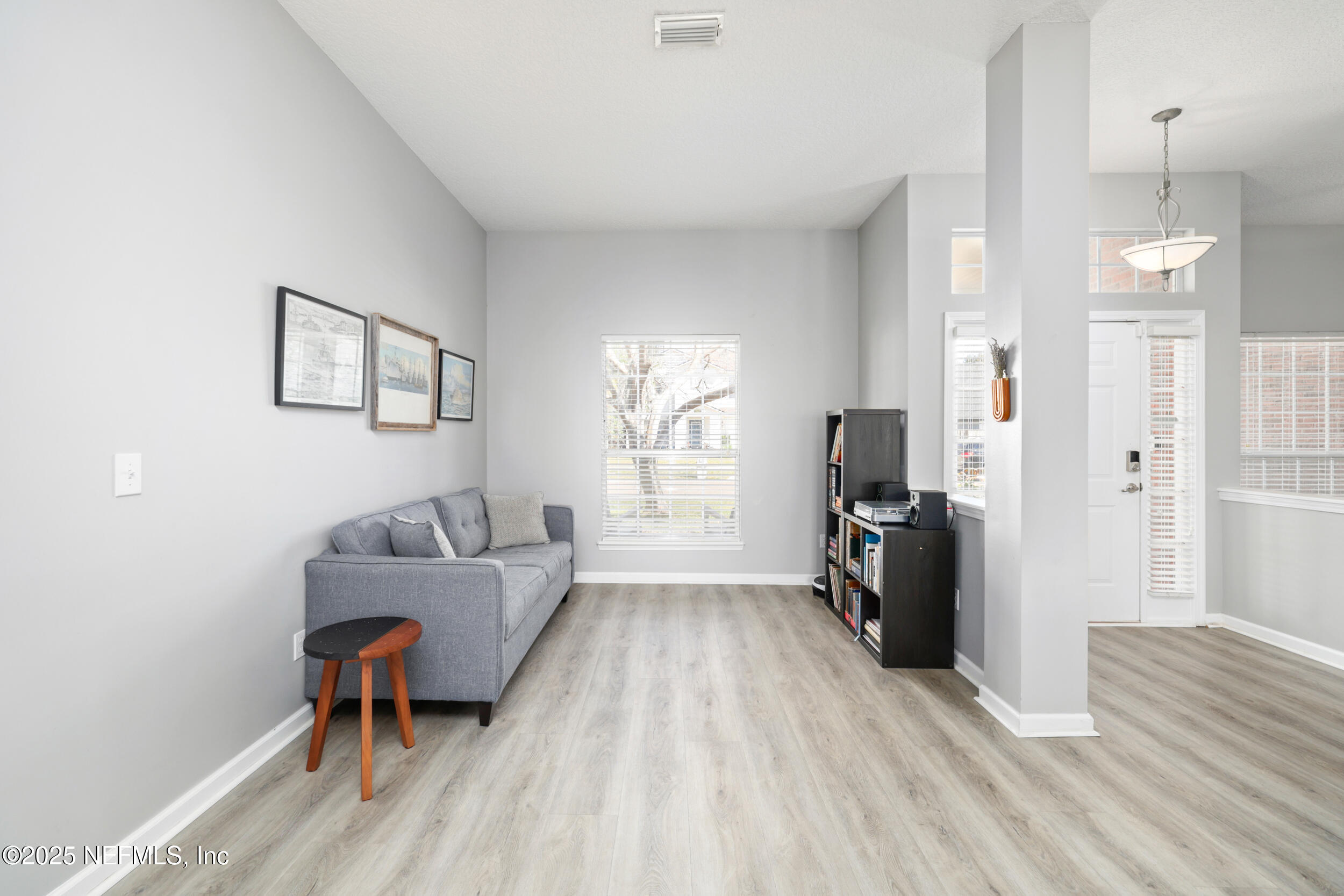 2948 Captiva Bluff Road South Jacksonville, FL 32226 - Photo 22 of 46 a living room with furniture and a wooden floor