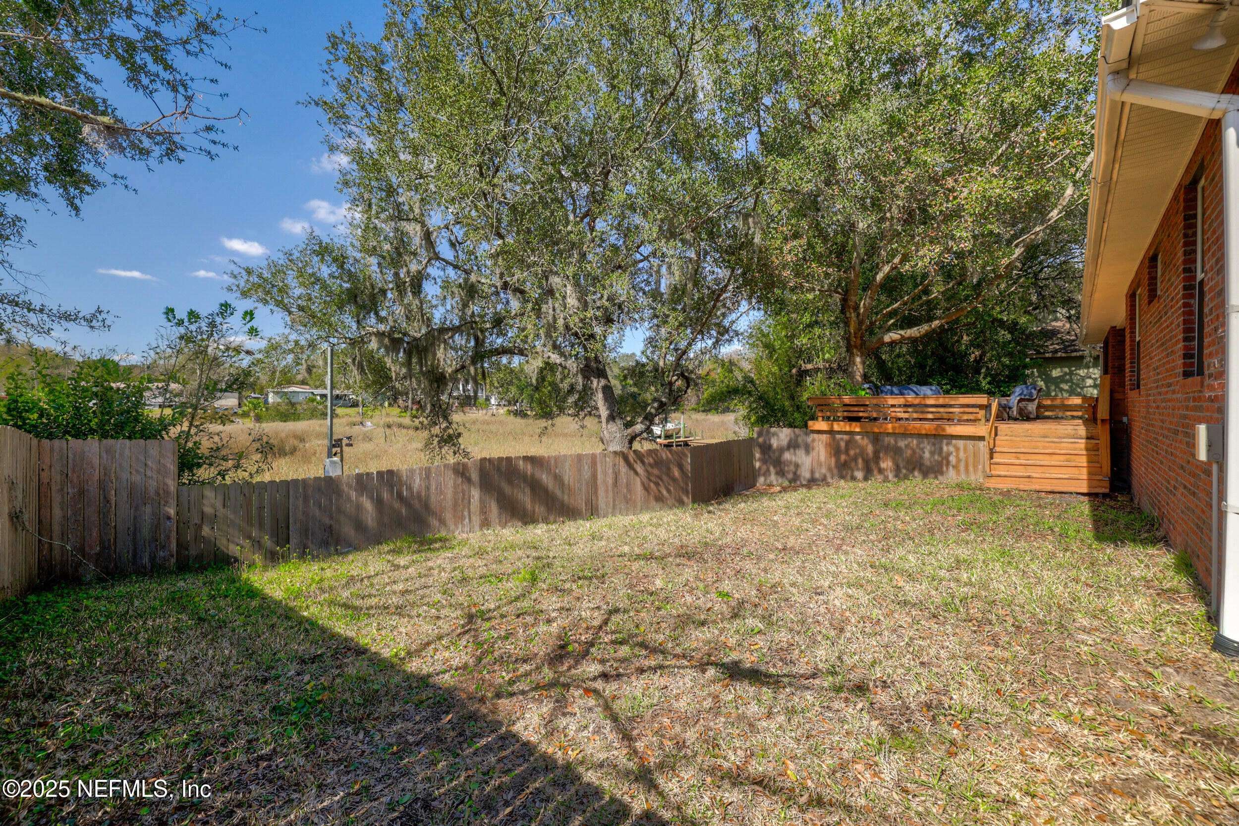2948 Captiva Bluff Road South Jacksonville, FL 32226 - Photo 34 of 46 a backyard of a house with lots of green space