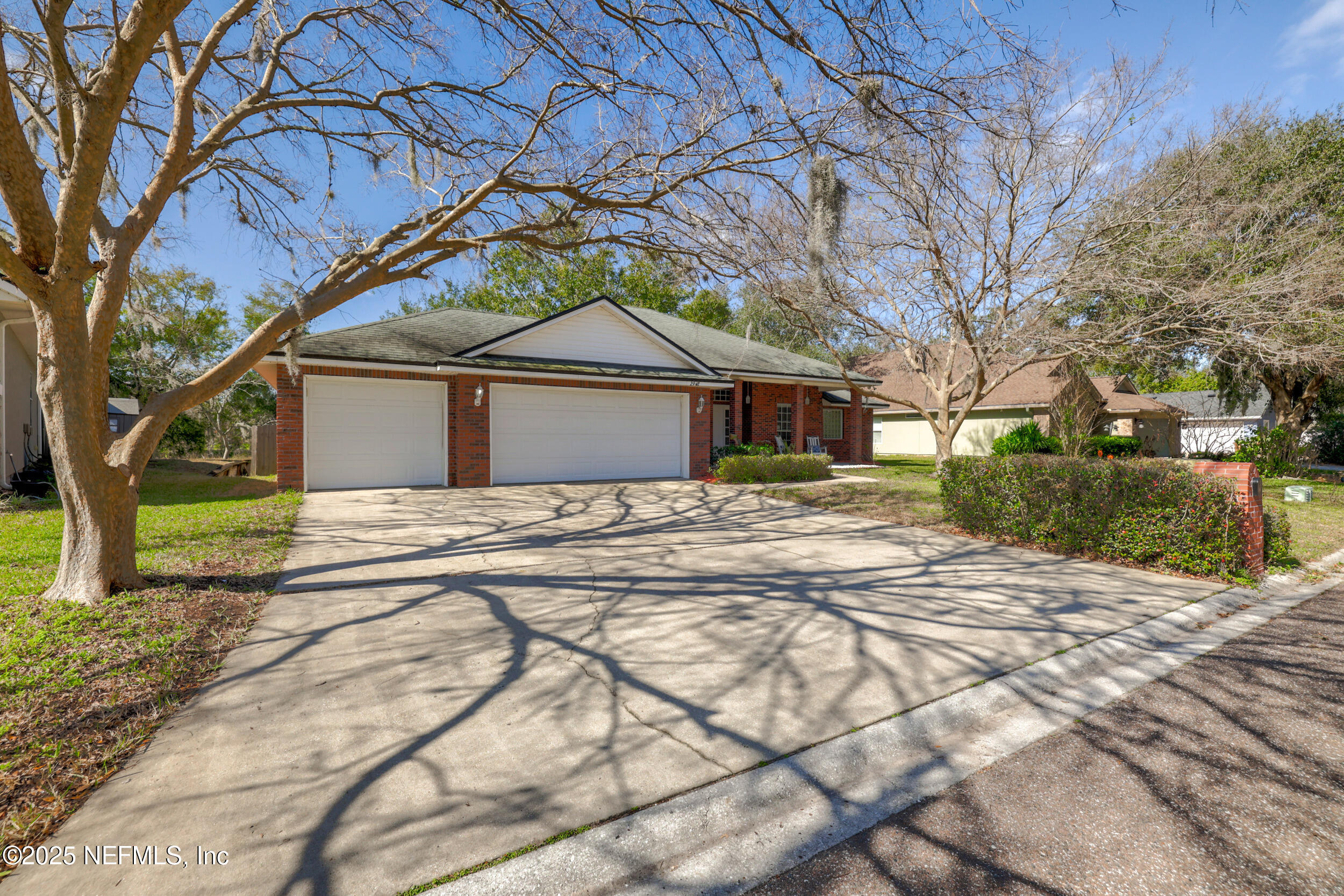 2948 Captiva Bluff Road South Jacksonville, FL 32226 - Photo 38 of 46 a front view of a house with a yard and trees