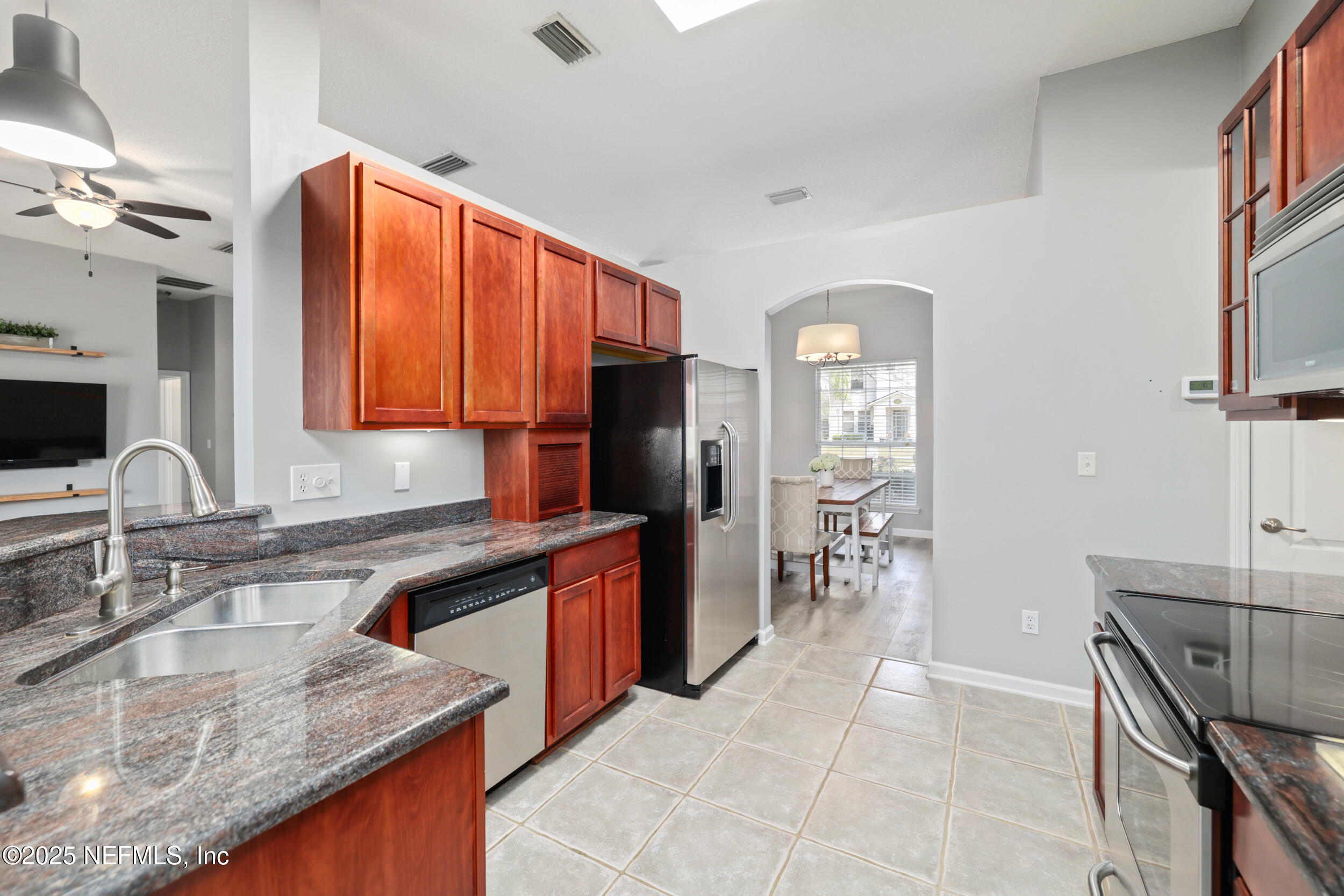 2948 Captiva Bluff Road South Jacksonville, FL 32226 - Photo 4 of 46 a kitchen with stainless steel appliances granite countertop a sink dishwasher stove and refrigerator