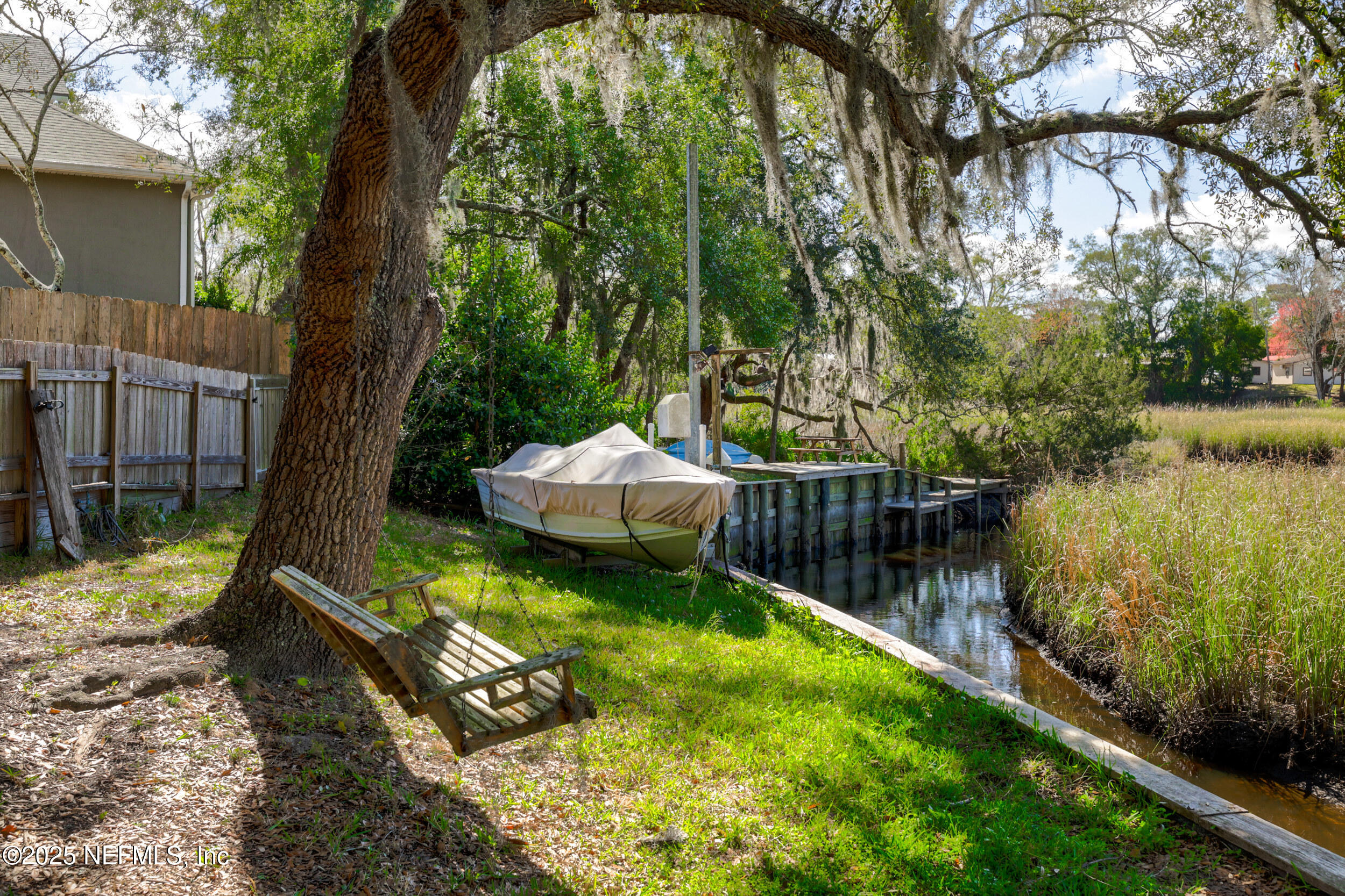 2948 Captiva Bluff Road South Jacksonville, FL 32226 - Photo 9 of 46 a view of a backyard with a garden and plants