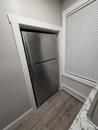 a view of a hardwood and utility room