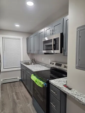 a kitchen with a stove and a microwave