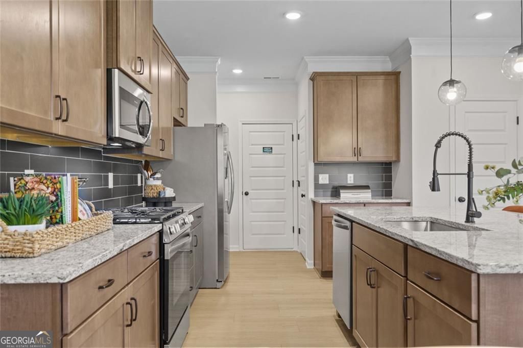 156 Saddle Ridge Trail Calhoun, GA 30701 - Photo 13 of 45 a kitchen with stainless steel appliances granite countertop a sink stove and refrigerator