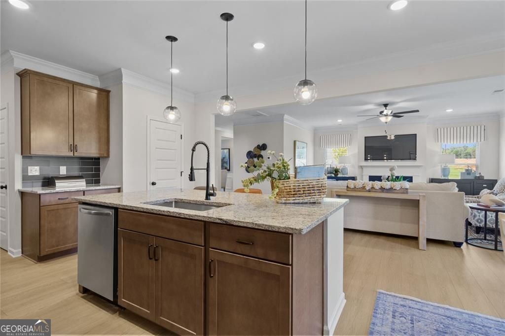 156 Saddle Ridge Trail Calhoun, GA 30701 - Photo 14 of 45 a large kitchen with kitchen island a sink counter space appliances and a living room view