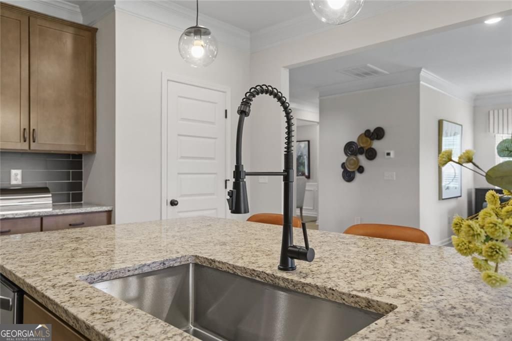 156 Saddle Ridge Trail Calhoun, GA 30701 - Photo 16 of 45 a kitchen with a granite countertop sink and a granite counter tops
