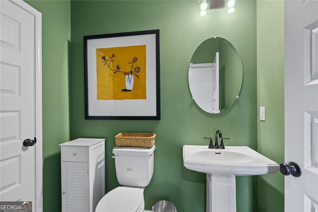 156 Saddle Ridge Trail Calhoun, GA 30701 - Photo 20 of 45 a bathroom with a toilet sink and mirror