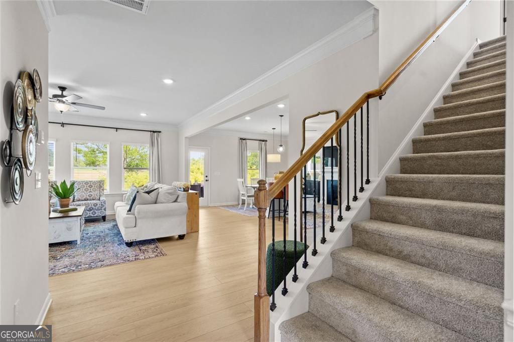 156 Saddle Ridge Trail Calhoun, GA 30701 - Photo 22 of 45 a living room with furniture and stairs