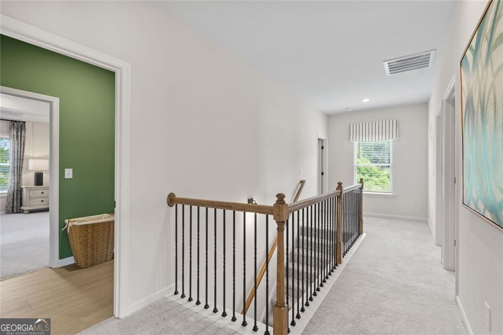 156 Saddle Ridge Trail Calhoun, GA 30701 - Photo 24 of 45 a view of a room with wooden floor and windows
