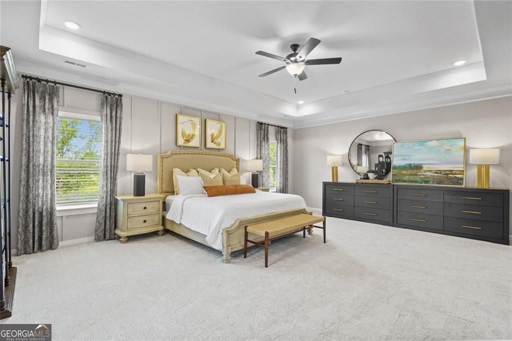 156 Saddle Ridge Trail Calhoun, GA 30701 - Photo 27 of 45 a bedroom with a large bed and ceiling fan