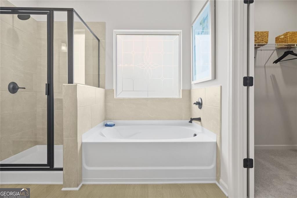 156 Saddle Ridge Trail Calhoun, GA 30701 - Photo 32 of 45 a bathroom with bathtub and shower