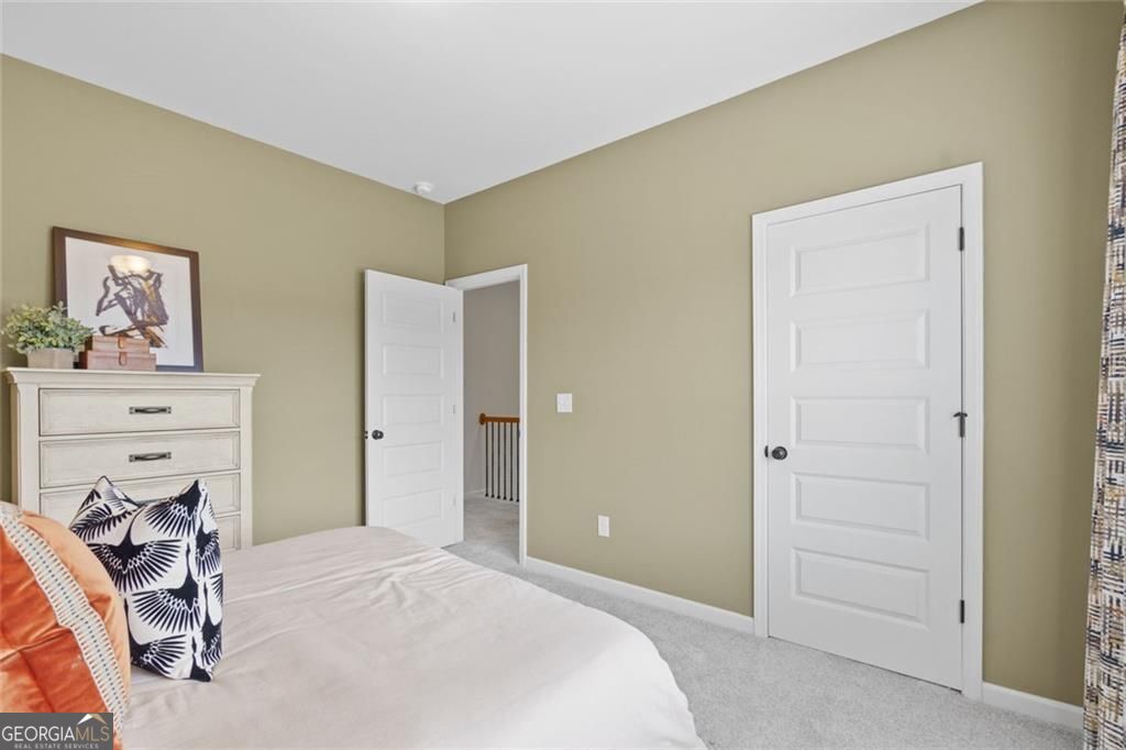 156 Saddle Ridge Trail Calhoun, GA 30701 - Photo 37 of 45 a bedroom with a bed and a tv