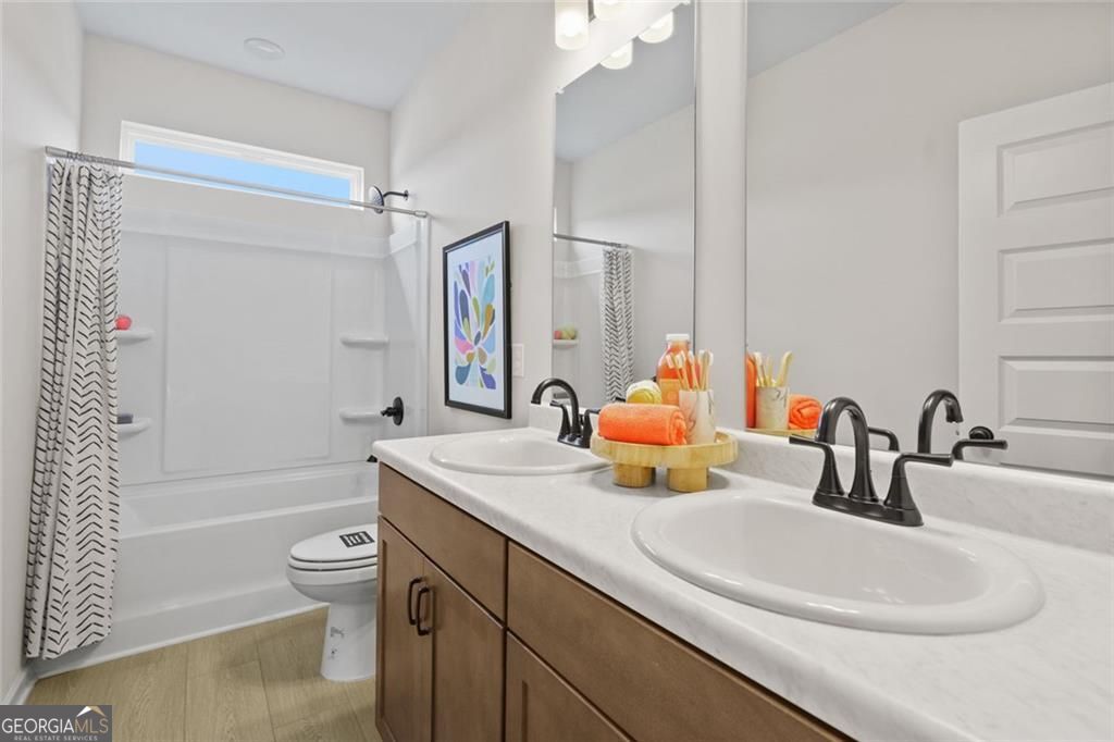 156 Saddle Ridge Trail Calhoun, GA 30701 - Photo 38 of 45 a bathroom with a sink a toilet and shower