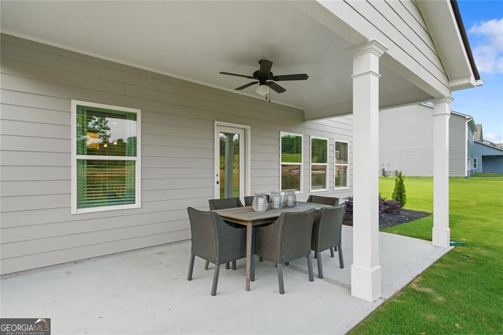 156 Saddle Ridge Trail Calhoun, GA 30701 - Photo 45 of 45 a view of a dining room with a table and chairs