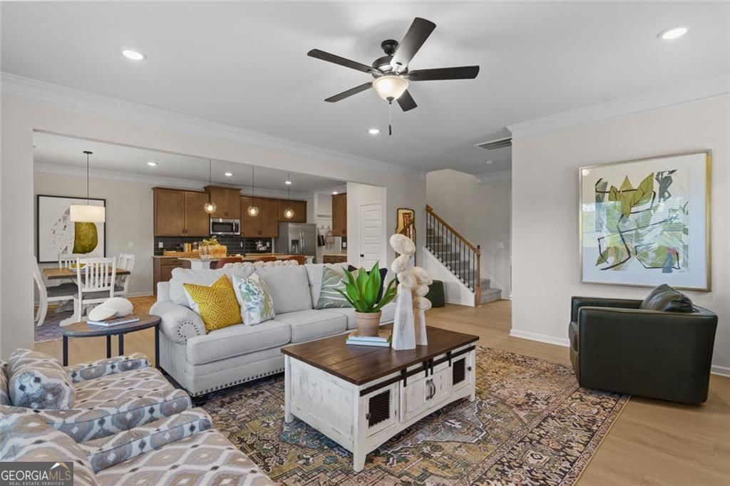 156 Saddle Ridge Trail Calhoun, GA 30701 - Photo 7 of 45 a living room with furniture and a flat screen tv