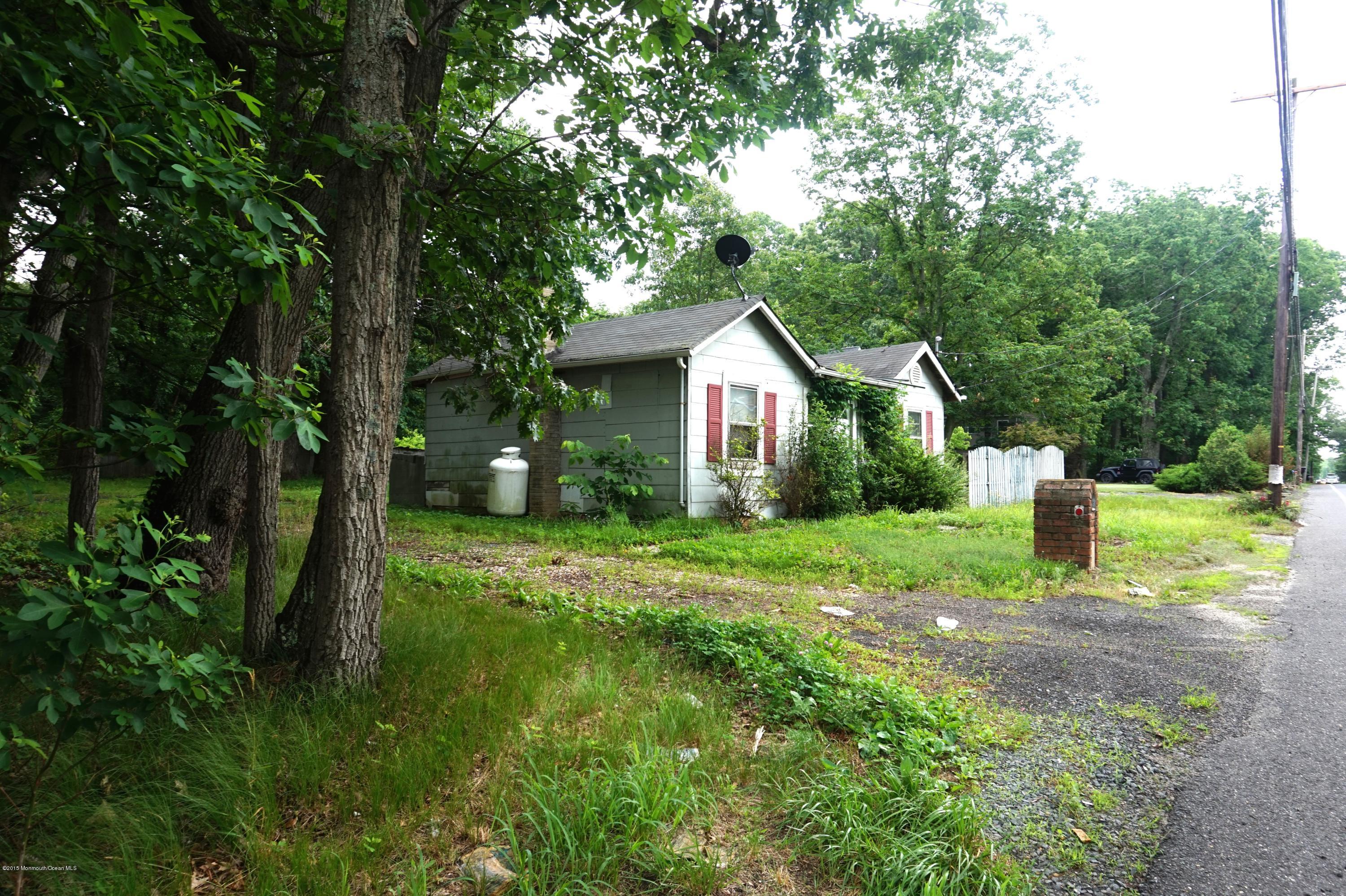 75 Siloam Road Freehold, NJ 07728 - Photo 1 of 9 a view of a house with backyard and garden