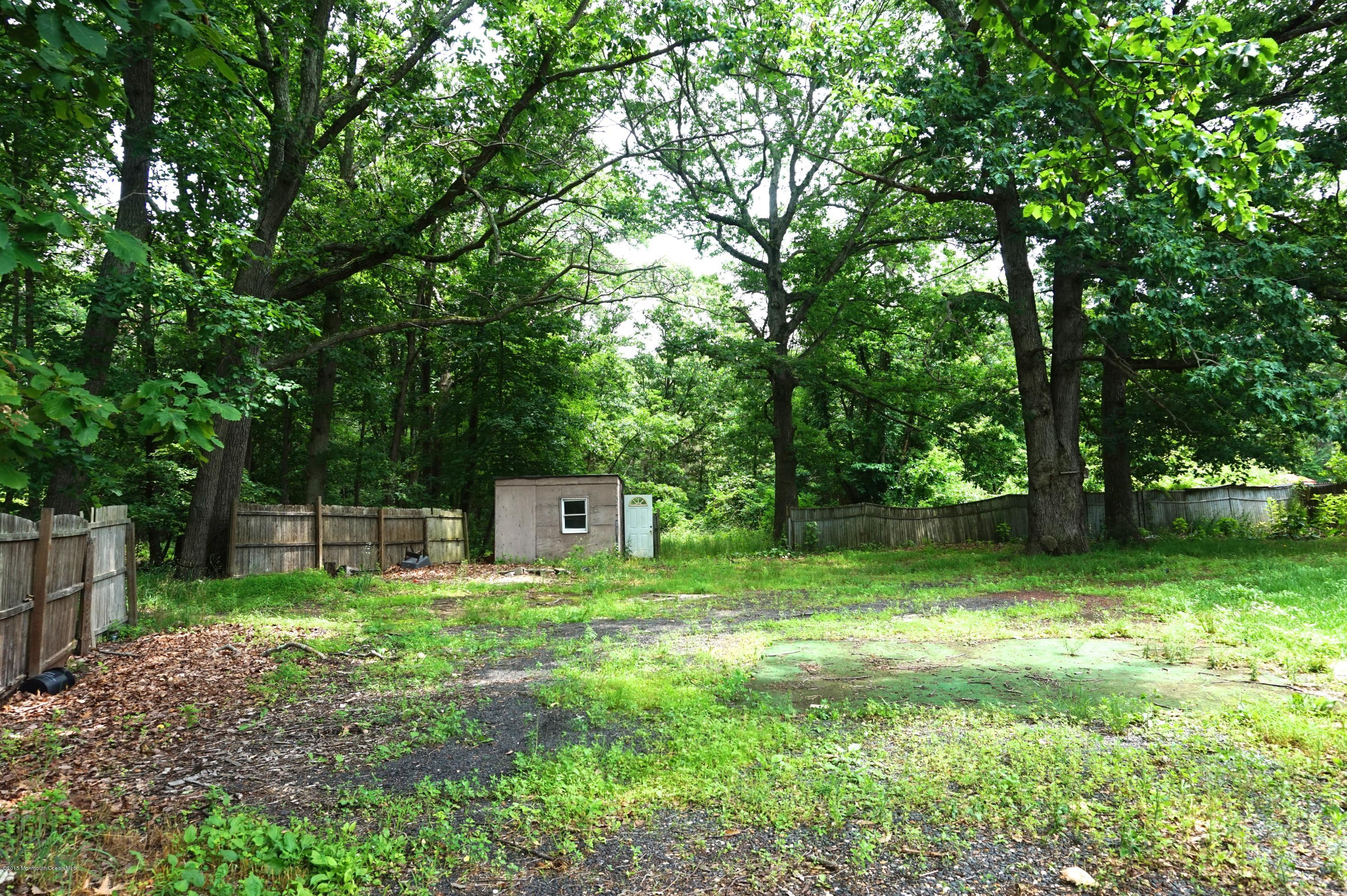 75 Siloam Road Freehold, NJ 07728 - Photo 2 of 9 a view of a backyard with a trees