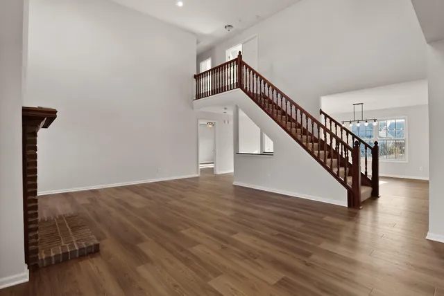 a view of an entryway with wooden floor