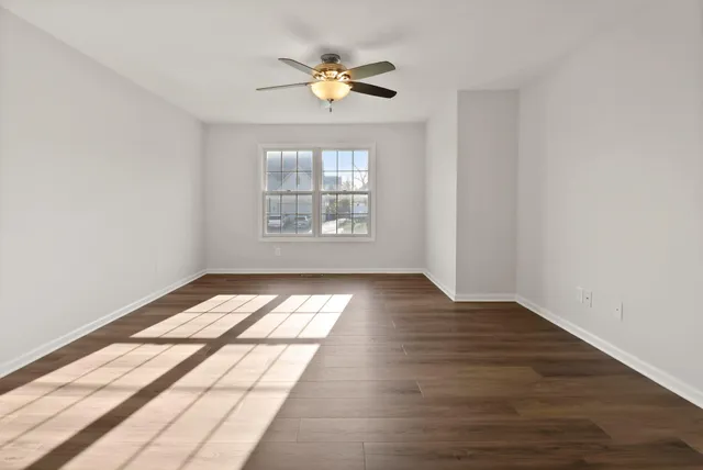 a very nice looking room with a ceiling fan