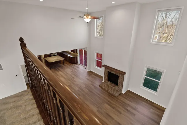 a view of a hallway with windows