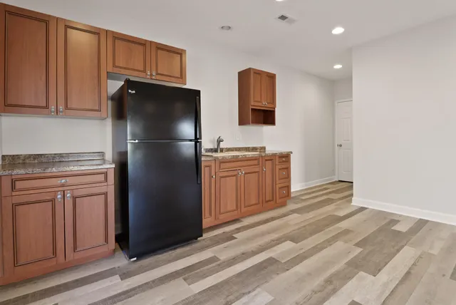a spacious bedroom with a bed and a large window