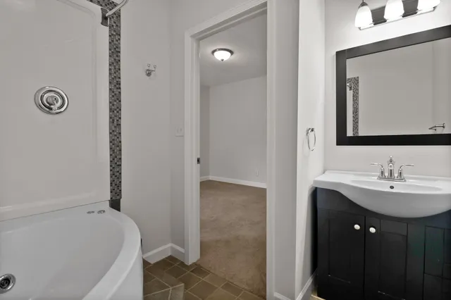 a view of balcony with wooden floor and fence