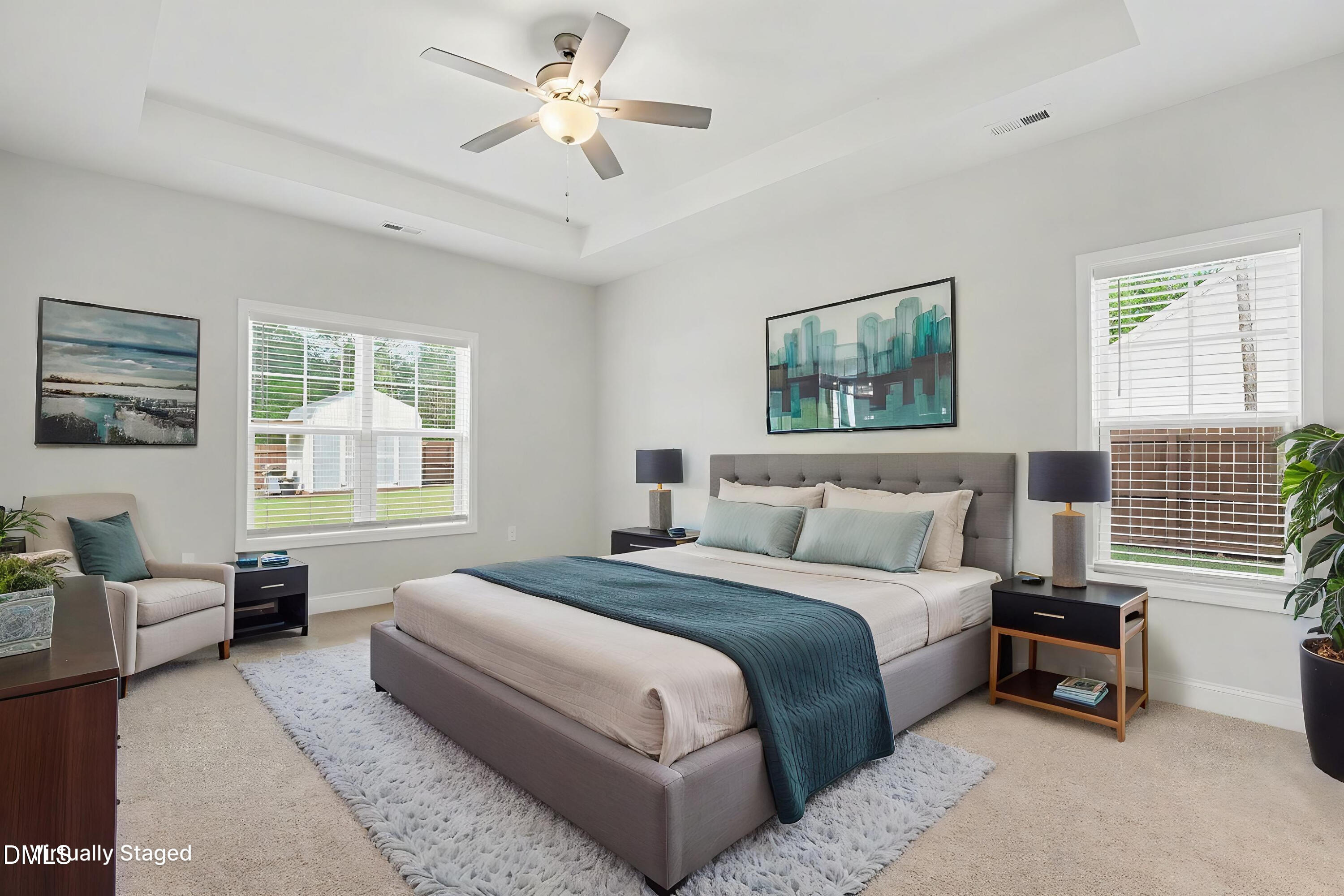 2815 Lemuel Black Road Spring Lake, NC 28390 - Photo 10 of 37 a spacious bedroom with a large bed couch and windows
