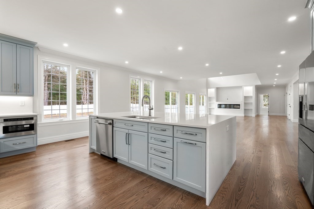 15 Marcus Road Sharon, MA 02067 - Photo 7 of 21 a large kitchen with stainless steel appliances granite countertop a large window and a sink