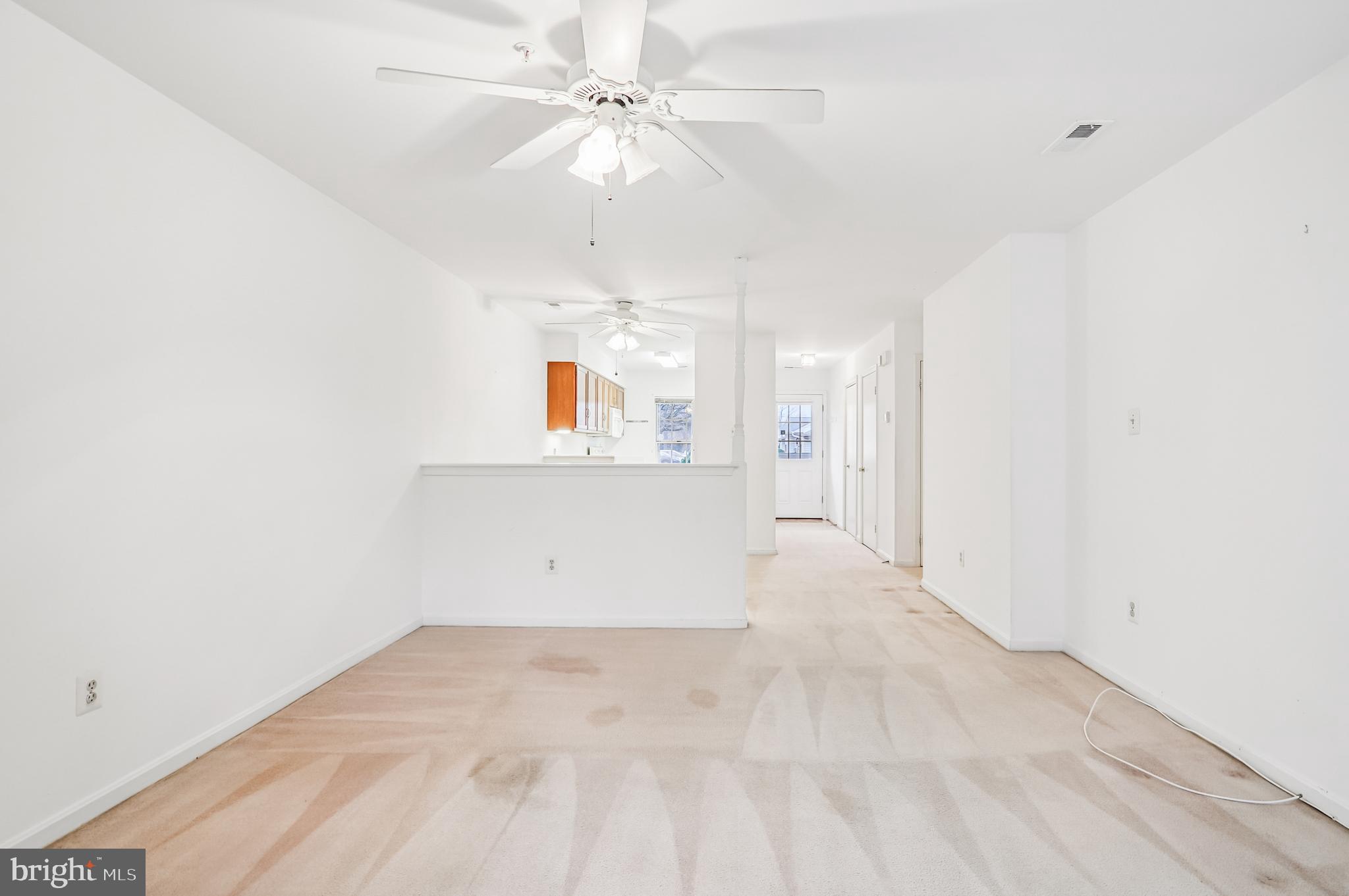 9272 Cherry Lane, Unit 75 Laurel, MD 20708 - Photo 12 of 37 an empty room with a ceiling fan and a window